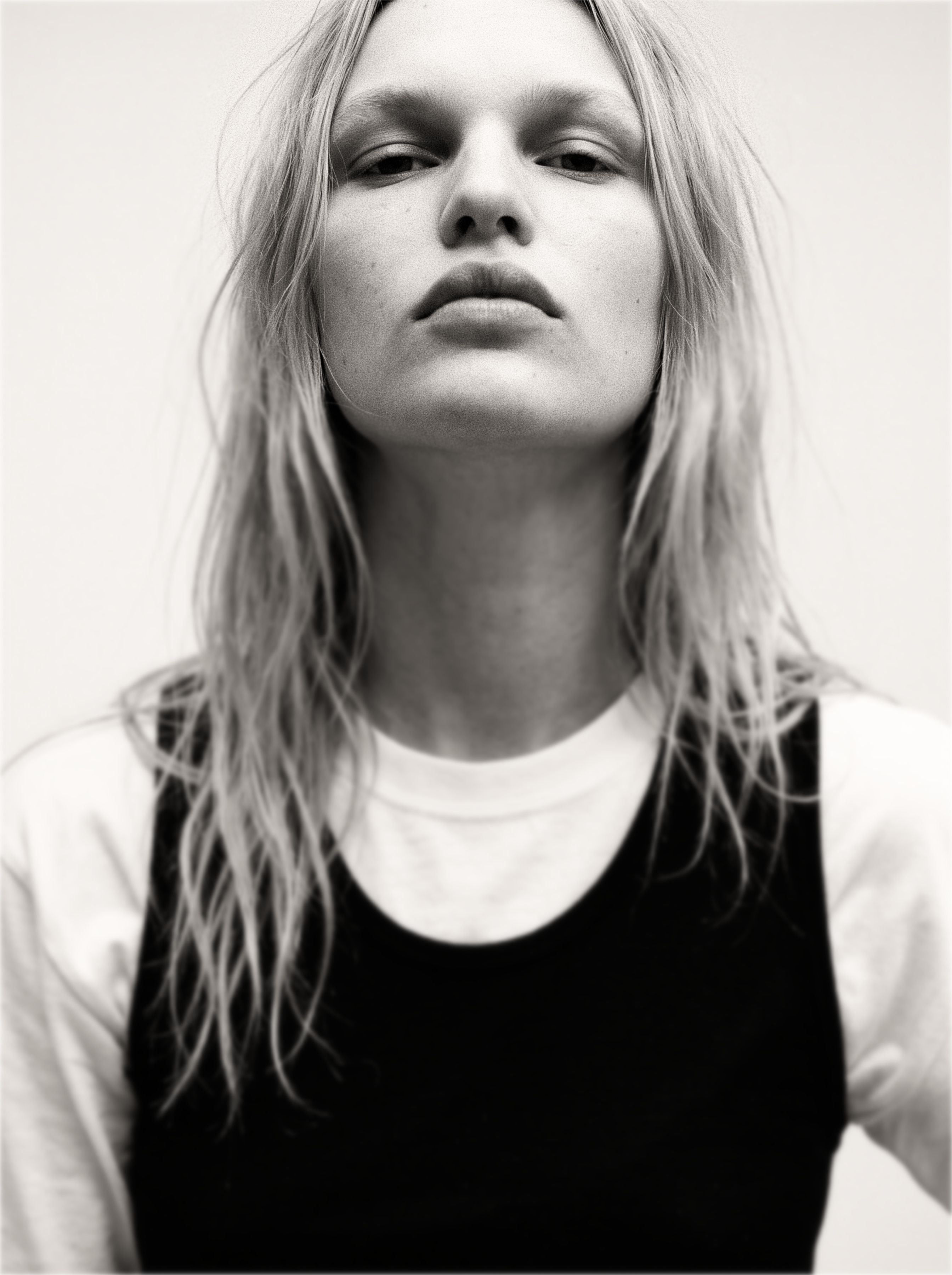 A monochrome lookbook portrait, direct gaze
