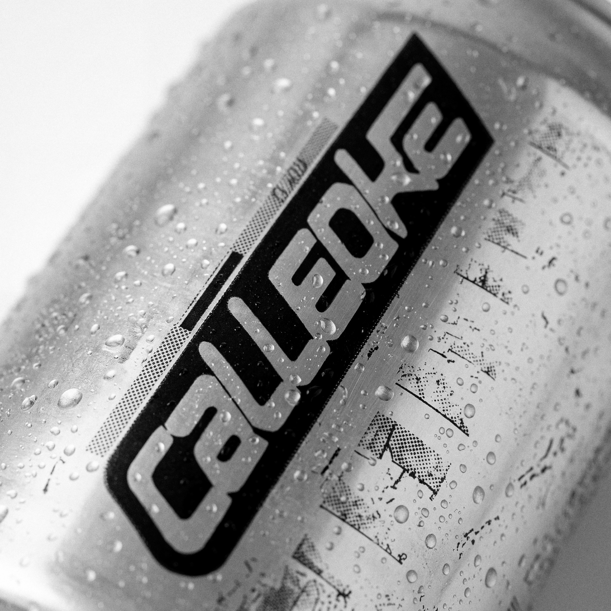 Dive Bar Plate 02 – macro detail of the condensation-beaded raw-silver Calleoke aluminium can with vertical black-ground wordmark and halftone diagram print.